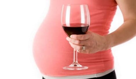 pregnant woman drinking wine