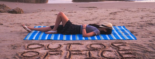 woman relaxing on beach with out of office